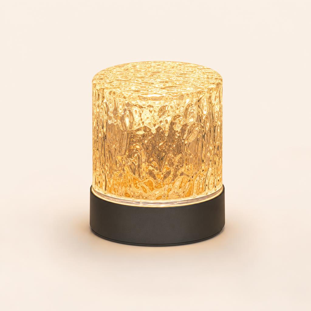 Emberglow round frosted glass lamp glowing warm amber on cream background